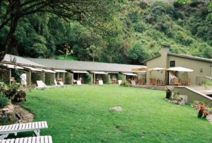 Machu-Picchu-Sanctuary-Lodge-grass-lawn-outside-rooms