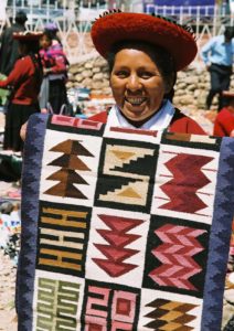 Chinchero-Peru-sunday-market-vendor-textile