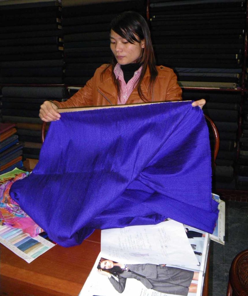 Hoi-an-Vietnam-sun-tailor-shop-measuring-fabric