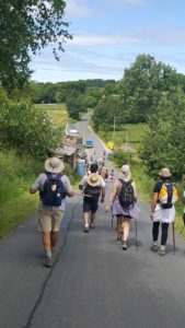 spain-camino-walk-group-pilgrims-paved-road