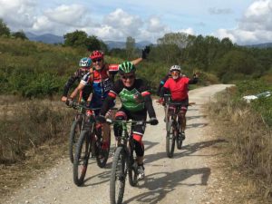 spain-camino-waving-cyclists