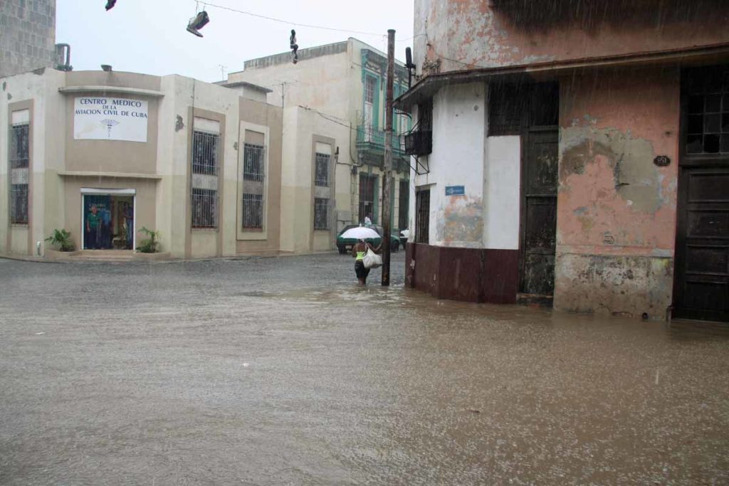 Havana-Cuba-rainstorm-flooded-street-corner-woman