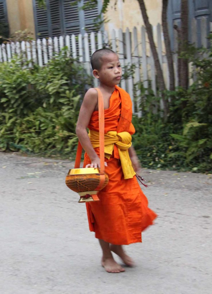 Laos-Luang-prabang-young-monk-alms-bowl