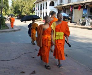 Laos-Luang-Prabang-monks-walking-down-street