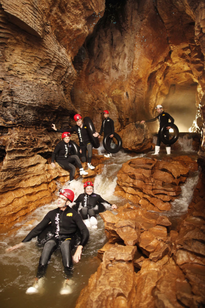 waitomo-caves-black-water-rafting-floating-on-tubes