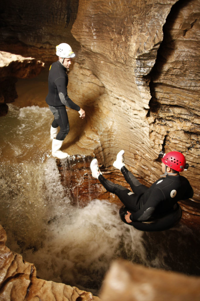 waitomo-caves-black-water-rafting-waterfall-backwards-jump