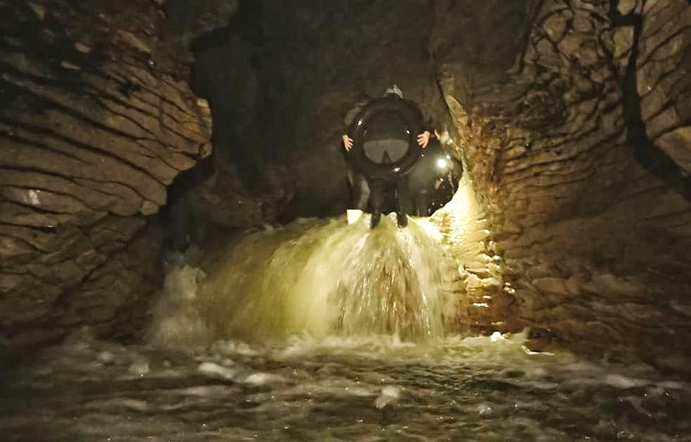 waitomo-caves-black-water-rafting-waterfall-backwards-jump