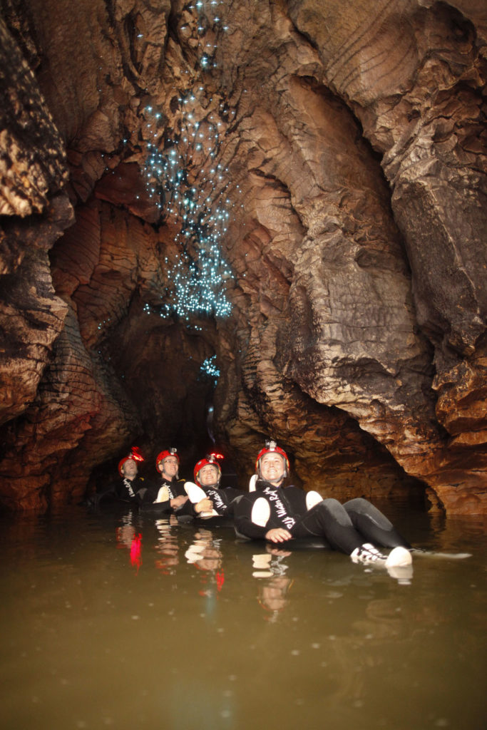 waitomo-caves-black-water-rafting-floating-as-group