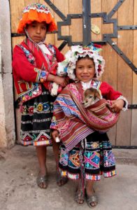 Pisac-Peru-girls-with-baby-lambs